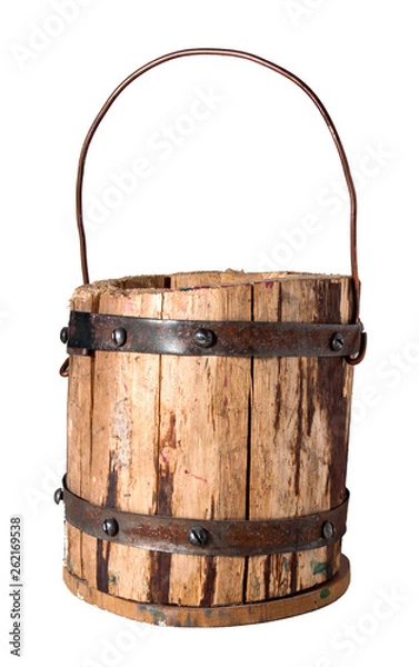 Fototapeta Wooden bucket fastened with metal hoops, with a metal handle. Handwork. Decorative element.