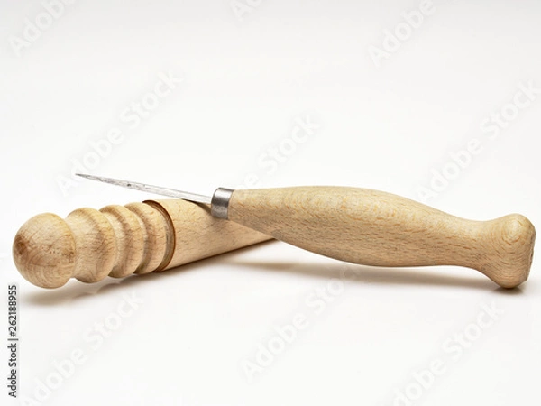 Fototapeta Used stitching awl and burnisher. Leather working tools isolated on white background.