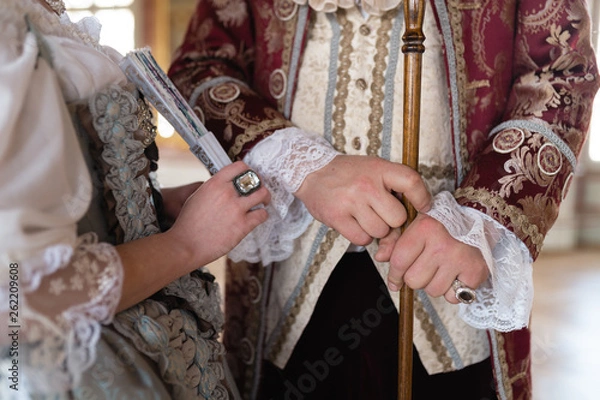 Fototapeta Retro style royal medieval ball - Majestic palace with gorgeous people dressed in king and queen's friends dresses with accessories such as fan and hand puch as a handbag - 2019