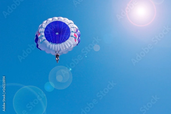 Obraz Flying in a balloon against the blue sky. Background with sunlight