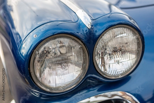 Fototapeta Fragment of a vintage car - headlights