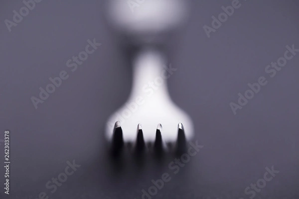 Fototapeta Fork concept with bokeh in black and white