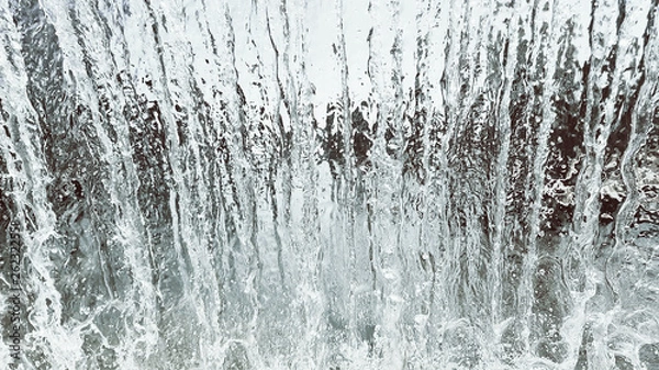 Fototapeta View from inside the waterfall. Streams of water flow from above. Shower and jet of fluid.