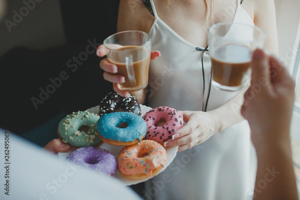 Obraz Man brought keeps donuts and coffee