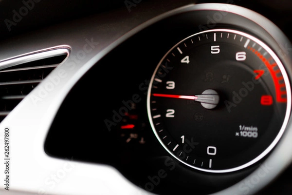 Fototapeta Luxury car steering wheel and dashboard with monitor.