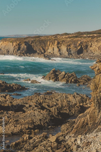 Fototapeta Cliff and rocks on the beach