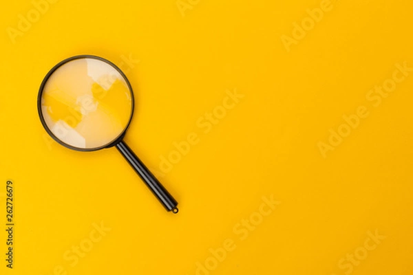 Obraz magnifying glass on yellow background