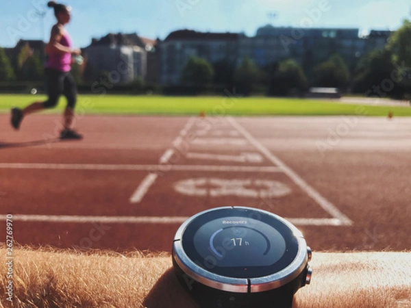 Obraz Trainer checking progress on smart watch