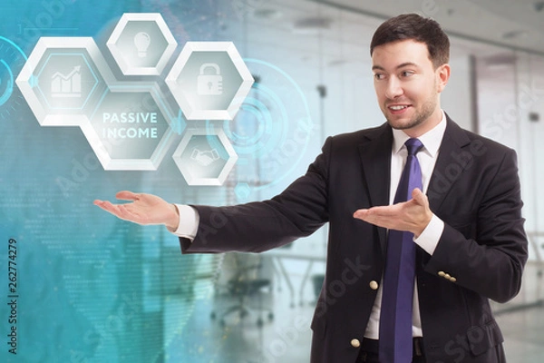 Fototapeta The concept of business, technology, the Internet and the network. A young entrepreneur working on a virtual screen of the future and sees the inscription: Passive income