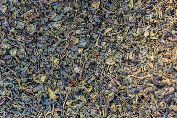 Fototapeta The texture of small dried tea on the whole frame