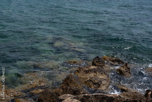 Obraz Sea and rocks. Translucent sea with a stone bottom.