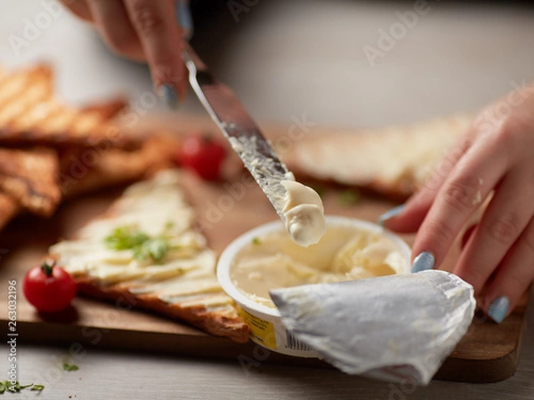 Fototapeta Melted cheese on bread