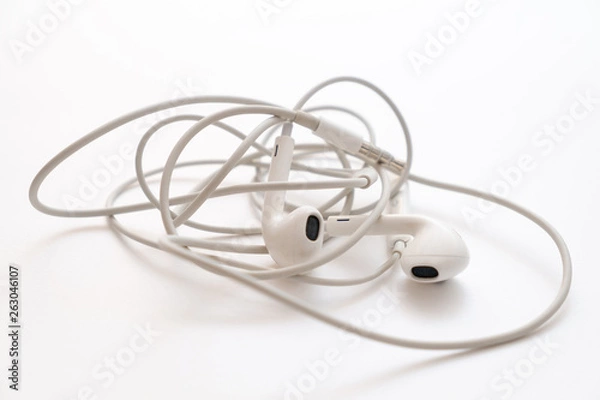Obraz headphones on a white background the wires of the headphones are tangled