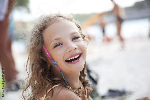 Obraz close-up portrait of a cute laughing girl at a beach
