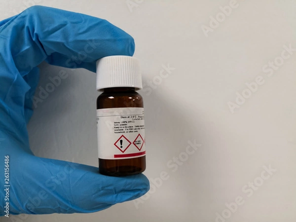 Fototapeta Object isolated on white background. Chemical reagent in an amber bottle.