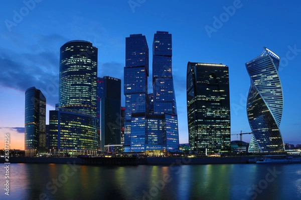 Fototapeta Moscow/ Russia April 19 2019: The unique skyscraper of Moscow city, the modern office center in the heart of capital of Russia in the evening in the rays of setting sun on the bank of Moskva river