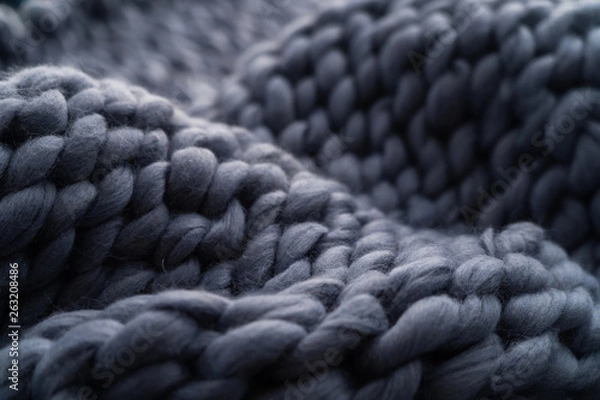 Fototapeta Merino wool handmade knitted large blanket, super chunky yarn, trendy concept. Close-up of knitted blanket, merino wool background. designer blanket made of beige smoky wool