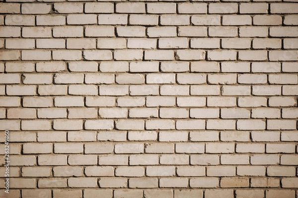 Fototapeta Background of old vintage dirty brick wall with peeling plaster, texture