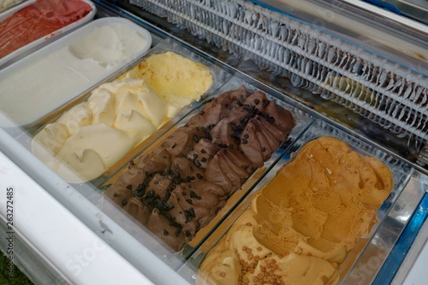 Fototapeta Close up of Ice cream in transparent freezer display