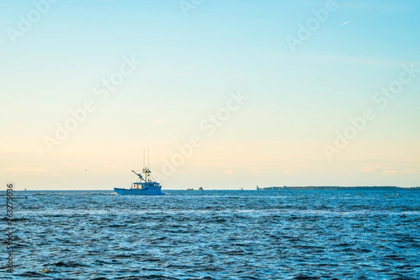 Obraz Lobster fishing boat scenery of Canada's Atlantic coast with a beautiful sky.