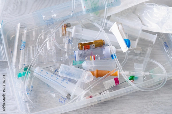Fototapeta medical syringes and ampoules of plastic and glass that were in use, waste