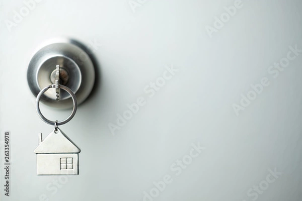 Obraz closeup key on the door, personal loan concept. soft focus.