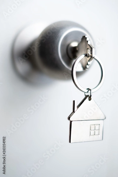 Obraz closeup key on the door, personal loan concept. soft focus.