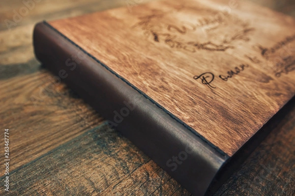 Fototapeta Leather binding wood book.