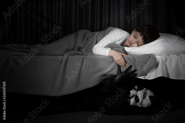 Fototapeta Little boy and monster under the bed. Bad dreams concept.