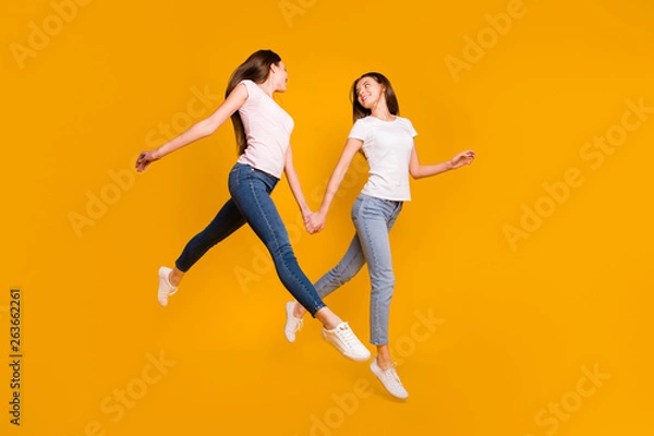 Fototapeta Full length body size view portrait of nice-looking attractive slim fit thin feminine girlish slender cheerful straight-haired ladies having fun spare time isolated over bright vivid shine background