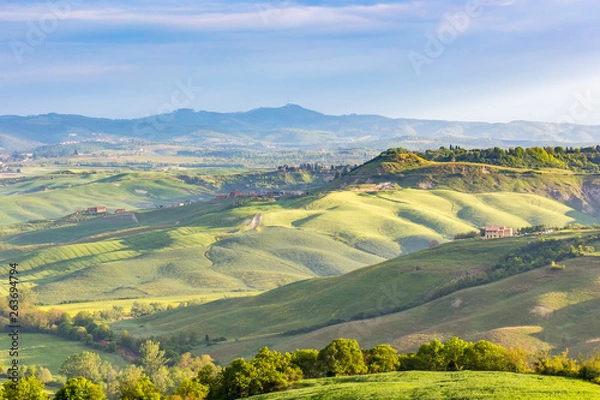 Fototapeta Rural view of the valley and fields in a rolling landscape