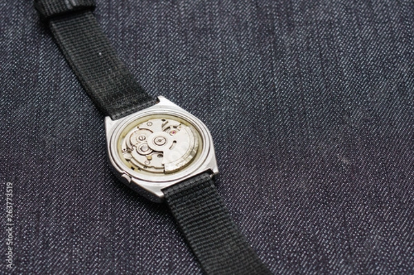 Obraz Closeup machine watch using as a background or wallpaper