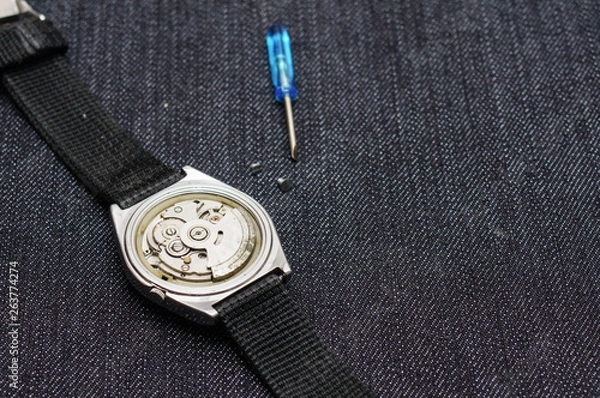 Obraz Closeup machine watch using as a background or wallpaper