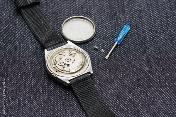 Obraz Closeup machine watch using as a background or wallpaper