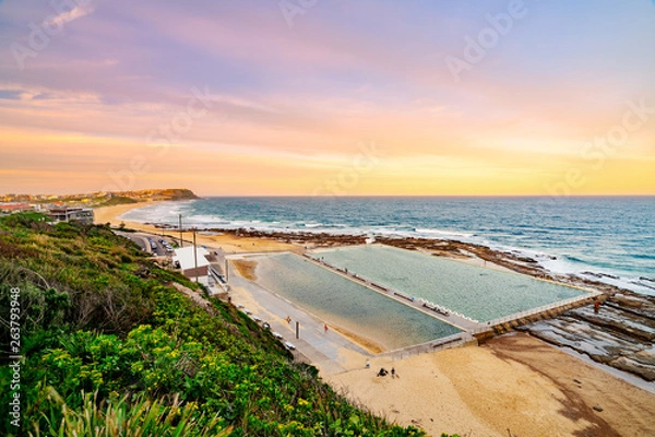 Fototapeta Sunset at Merewether beach overlooking the Merewether ocean baths in Newcastle, New South Wales, Australia
