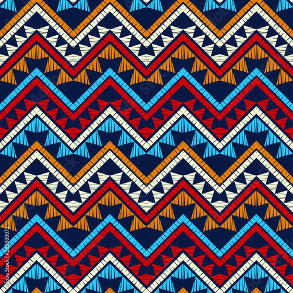 Fototapeta Ethnic boho seamless pattern. Zigzag. Embroidery on fabric. Patchwork texture. Weaving. Traditional ornament. Tribal pattern. Folk motif. Can be used for wallpaper, textile, invitation card, wrapping,