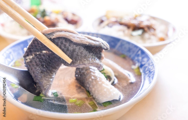 Fototapeta Milkfish skin soup, distinctive Taiwan delicacy food in Tainan. Famous meal set for lunch or breakfast with vegetable, top view, copy space, close up