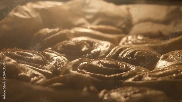 Obraz Selective focus shot of cinnabon baking, time-lapse