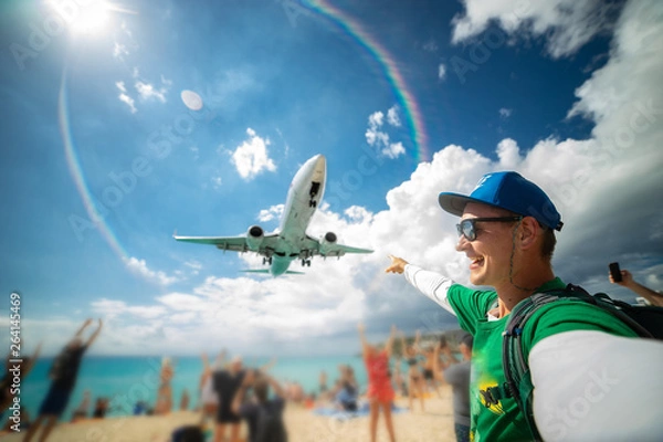 Fototapeta Perfect selfie with beach and airplane on background. Maho beach. Traveling concept