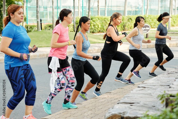 Fototapeta Women running outdoors