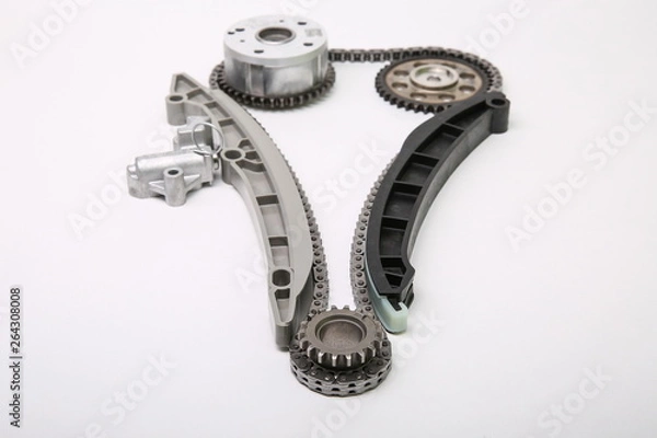 Fototapeta set of car engine timing chain isolated on white background. the gear of crankshaft in system of gas distribution mechanism on white background. timing kit of a car engine