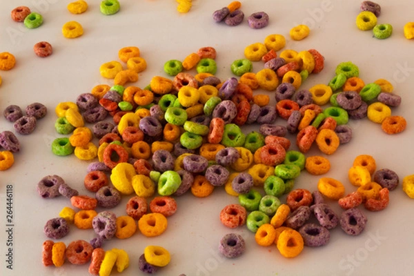 Obraz top view of colorful cereal with white background