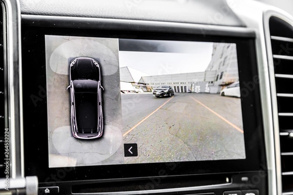 Fototapeta Working of front camera of circular 360 degrees view system. Image display on the head unit. Multimedia in the car. Options inside automobile