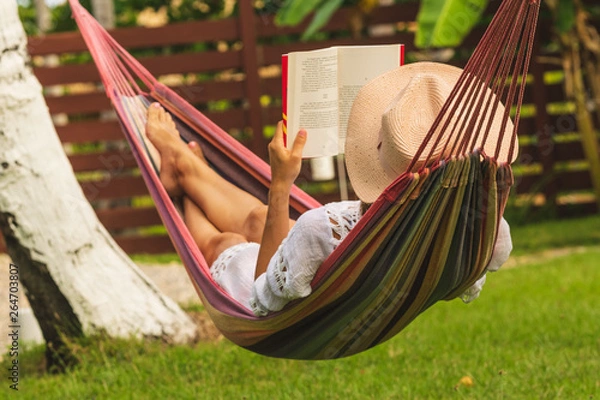 Obraz Beautiful woman relaxing in hammock.
