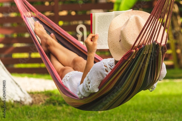 Obraz Beautiful woman relaxing in hammock.
