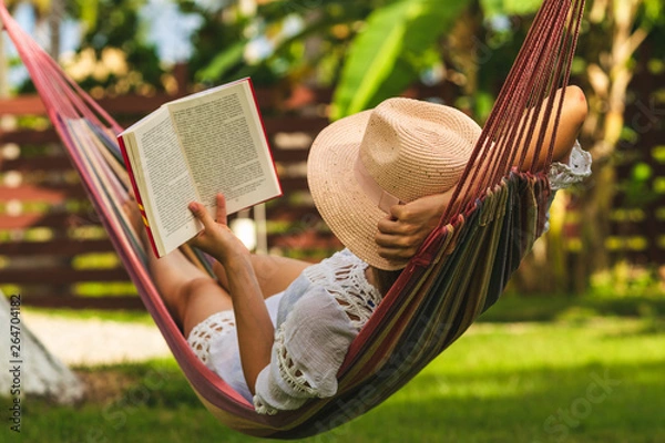 Obraz Beautiful woman relaxing in hammock.