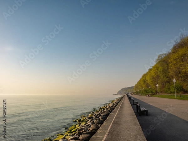 Fototapeta The seaside boulevard in Gdynia in the morning. Amazing concrete promenade near the beach at spring.
