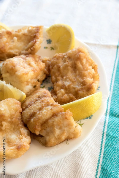 Obraz Breaded and fried Salted cod with lemon