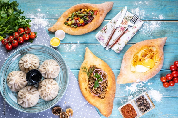 Fototapeta Georgian cuisine foodset from khachapuri, khinkali, top view.