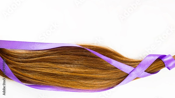 Fototapeta long blond hair donationwith lavender ribbon as symbol of fight against cancer on white background. Top view. Natural material for making wig for patients. Horizontal with copy space, isolated Concept
